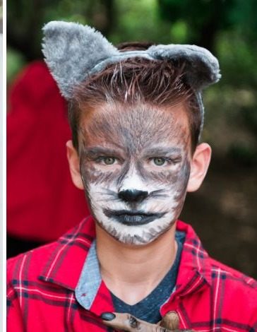 Close-up of a boy in Big Bad Wolf face paint with gray wolf ears
