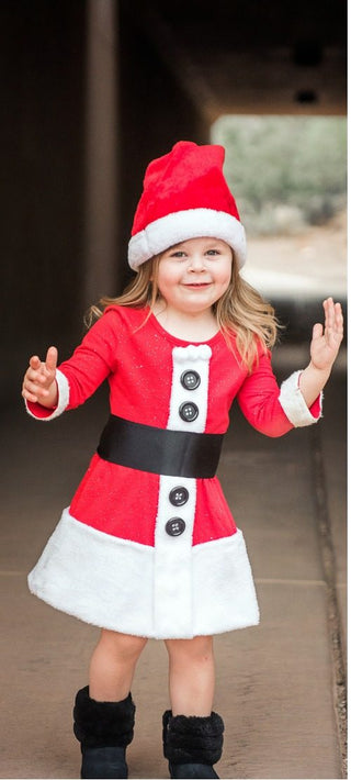 Toddler in a red and white Santa dress with a black belt and boots