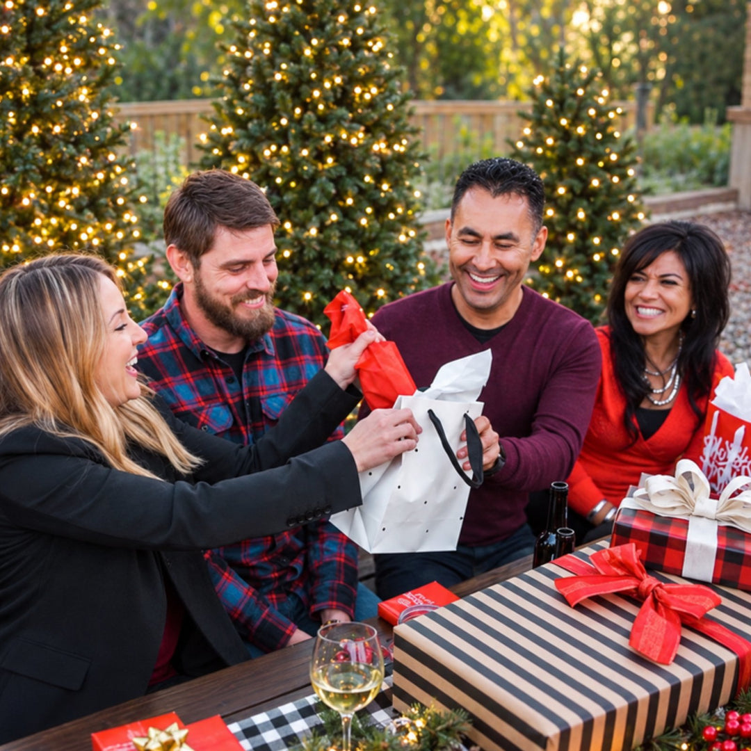 Four adults laughing as one opens a gift during a family Christmas gift exchange with That Gift Game