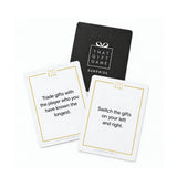The Surprise deck and two play cards from That Gift Game, a gift swap game for all ages